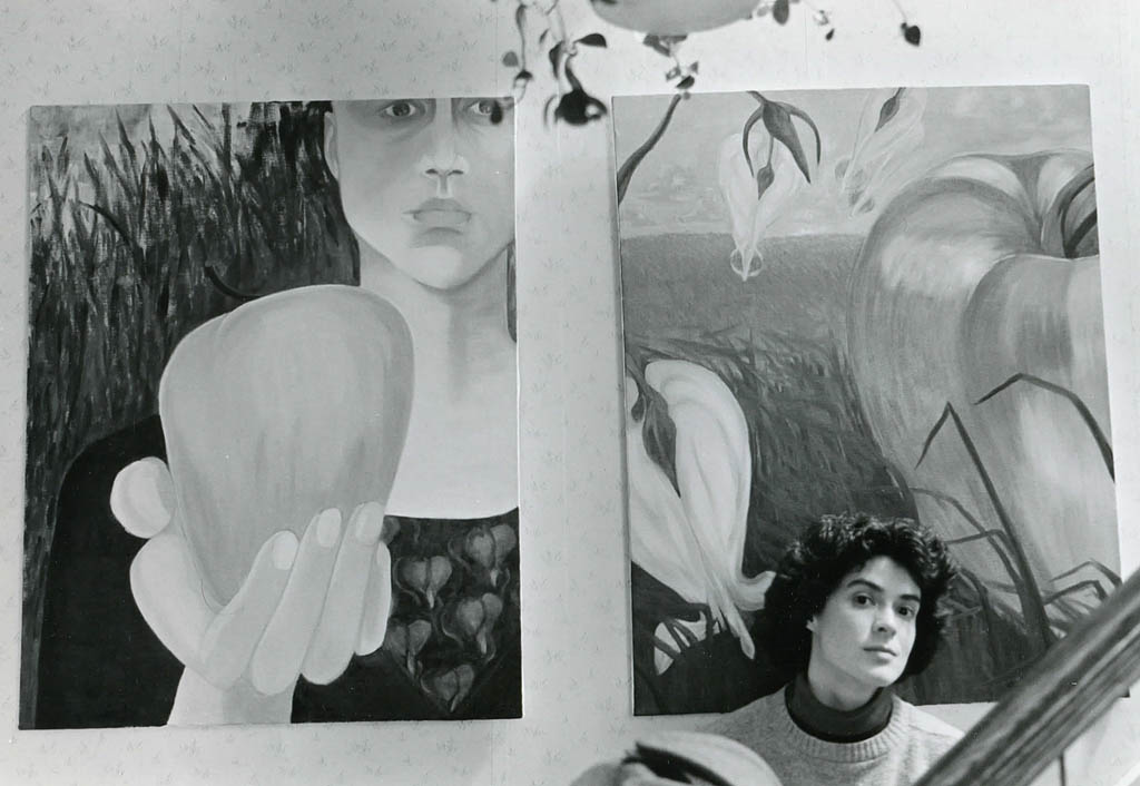 Gretchen with two of her paintings in 1986. Hubley Archives.