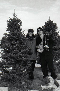 Posing with our prey at Merry Christmas Trees, Windham, in 1994. Photo by self-timer/scanned from black & white negative.