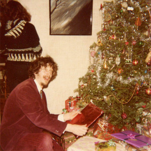 Me under the Hubley Christmas tree in the mid-1970s. My sister Nancy has her back to the camera. Hubley Family photo.