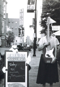 Long-necked woman with a black skirt: Howling Turbines bassist Gretchen Schaefer at the Free Street Taverna, Aug. 1, 1999. Photo by Jeff Stanton.