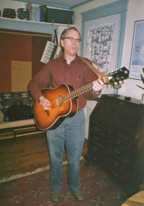 The venerable Silvertone in 2005, 34 years after I got it. Gretchen took this image the night before I sold the guitar to a Bates College student from Rwanda, who sent it home as a gift to her boyfriend. I wonder how it's doing.